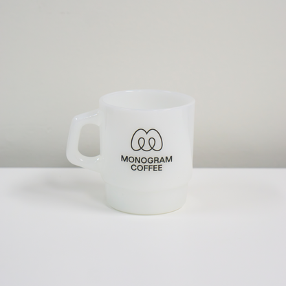 White mug with 'Monogram Coffee' logo on a white background