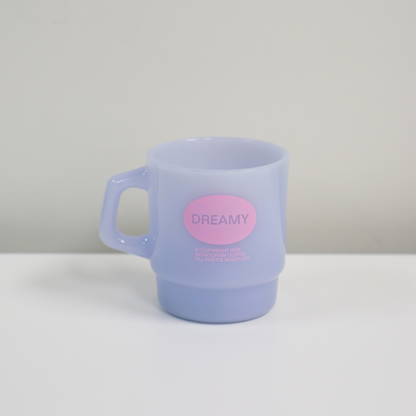 Pastel purple mug with a pink label on a white surface
