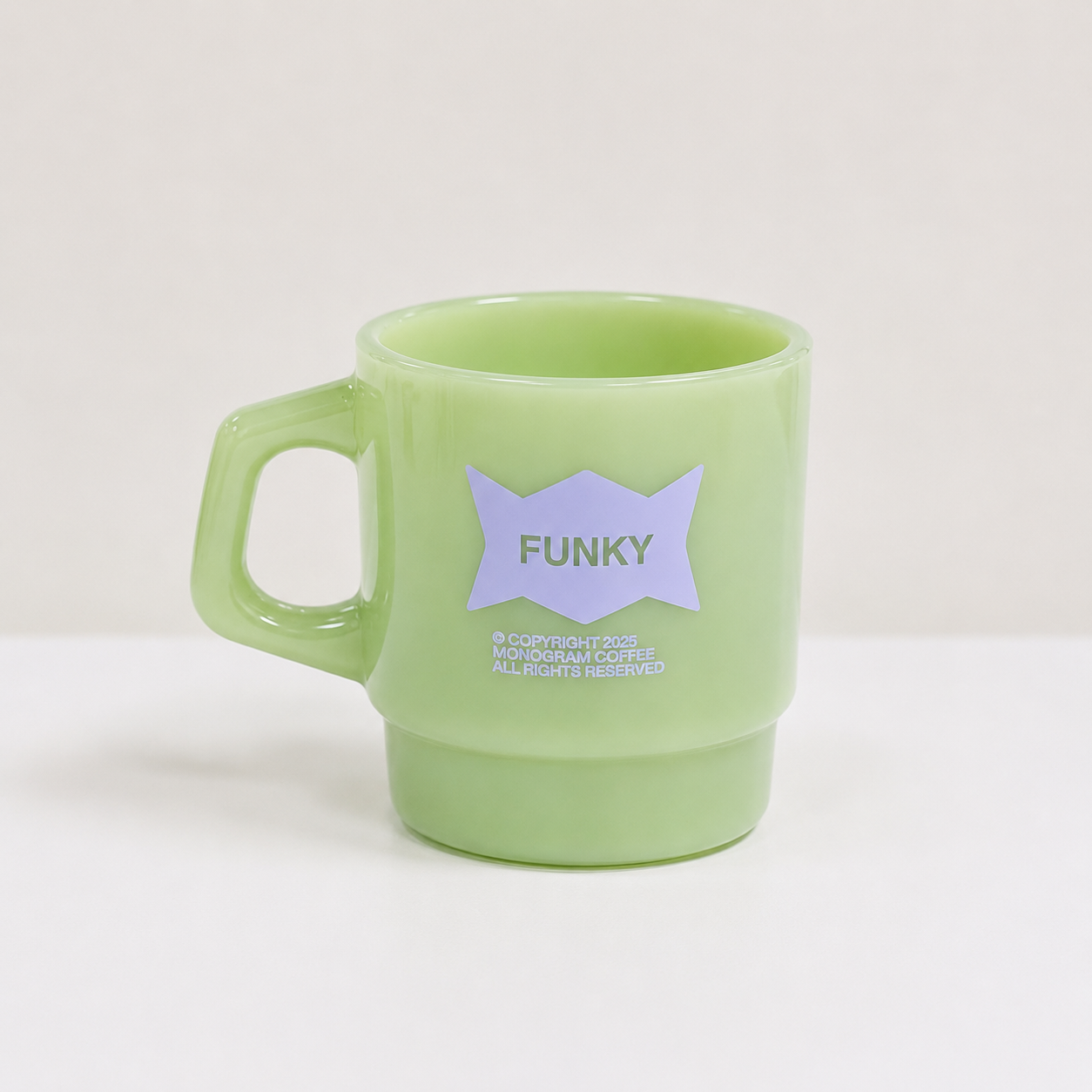 Green mug with a purple star and 'FUNKY' text on a white background